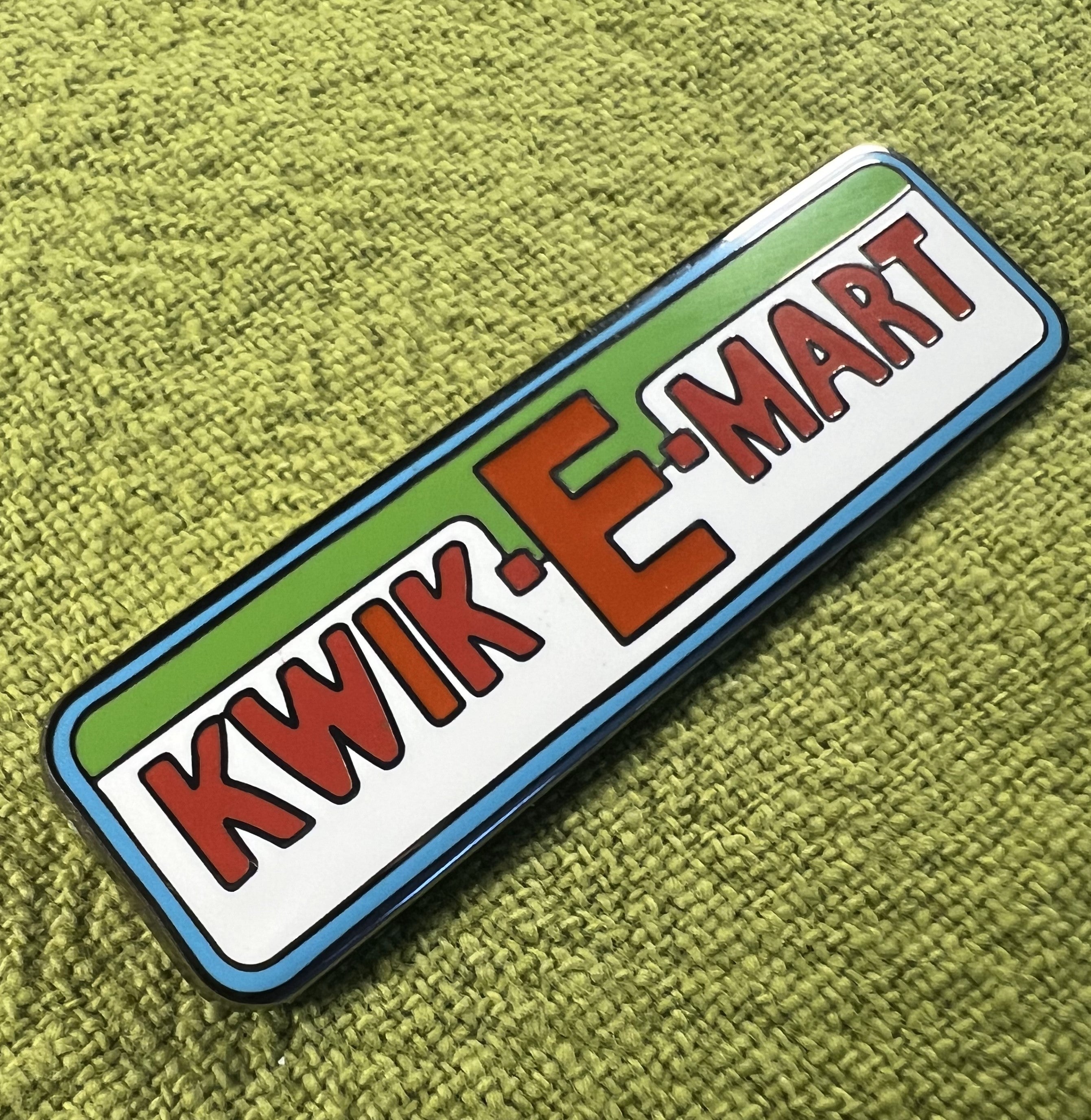 Kwik-E-Mart Enamel Pin by Tim Doyle