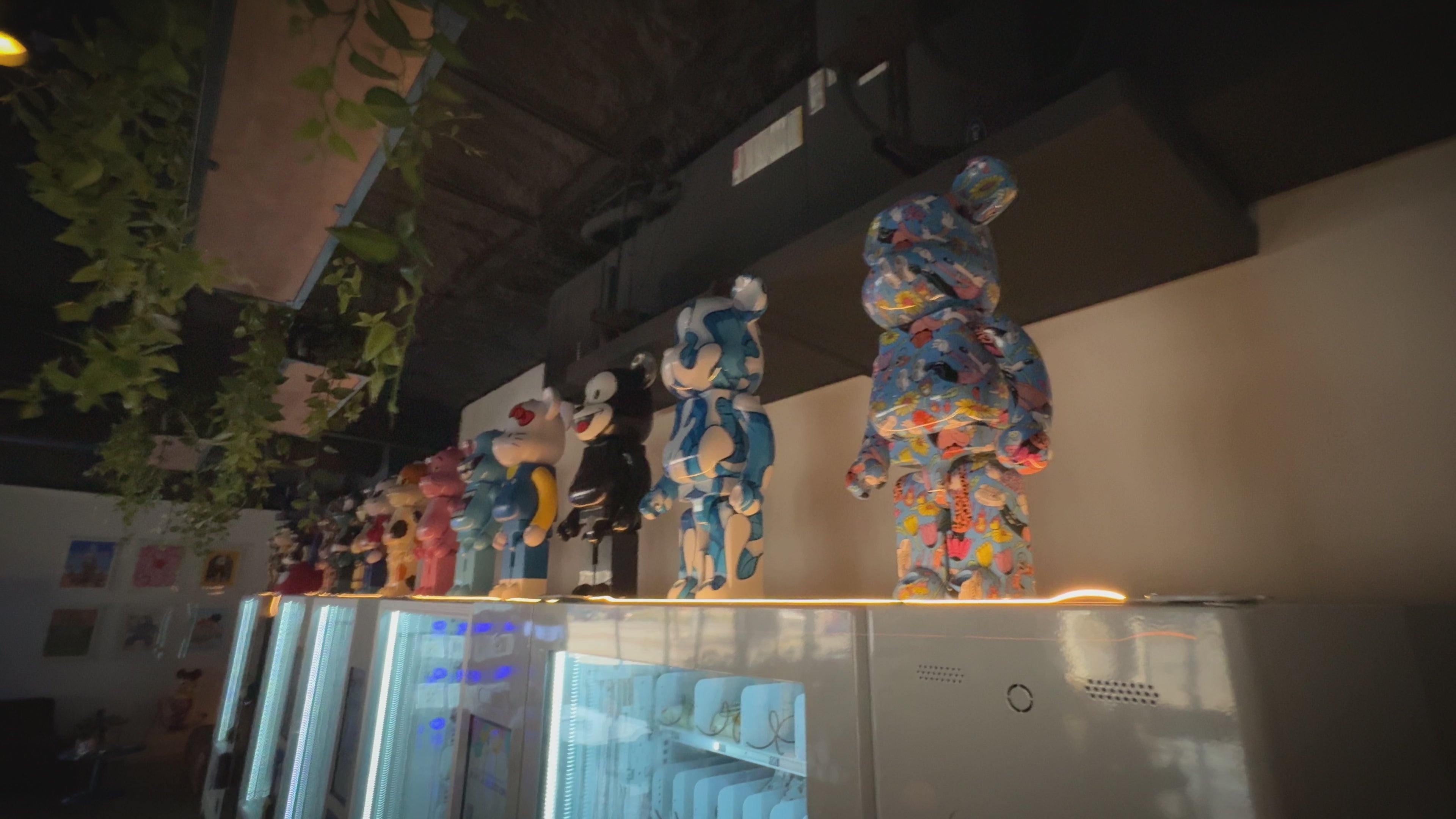 Load video: Walk through of the Velcrokid cafe. Showing various art toys and vending machines.